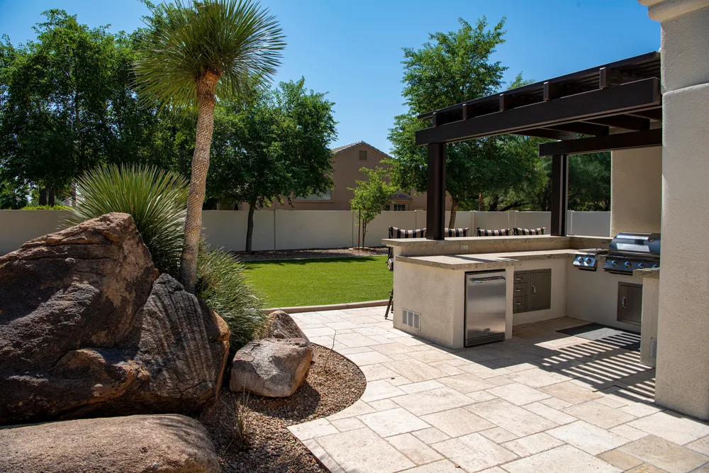 The same ground finished as an outdoor kitchen and patio